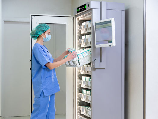 A nurse taking a medicine from the RFID Cabinet